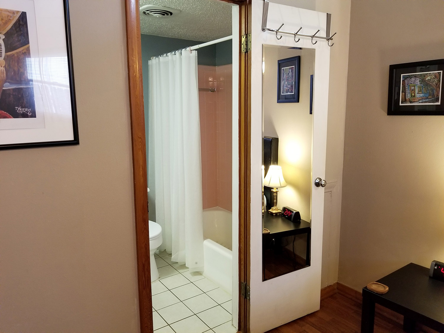 photo looking into bathroom from primary bedroom